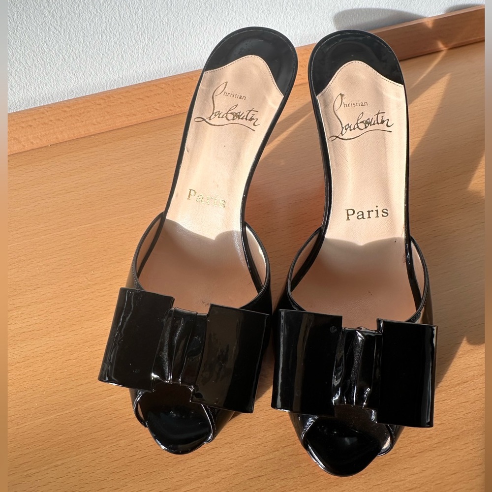 Christian Louboutin "Joli Noeud" black patent bow peep toe slide on mule